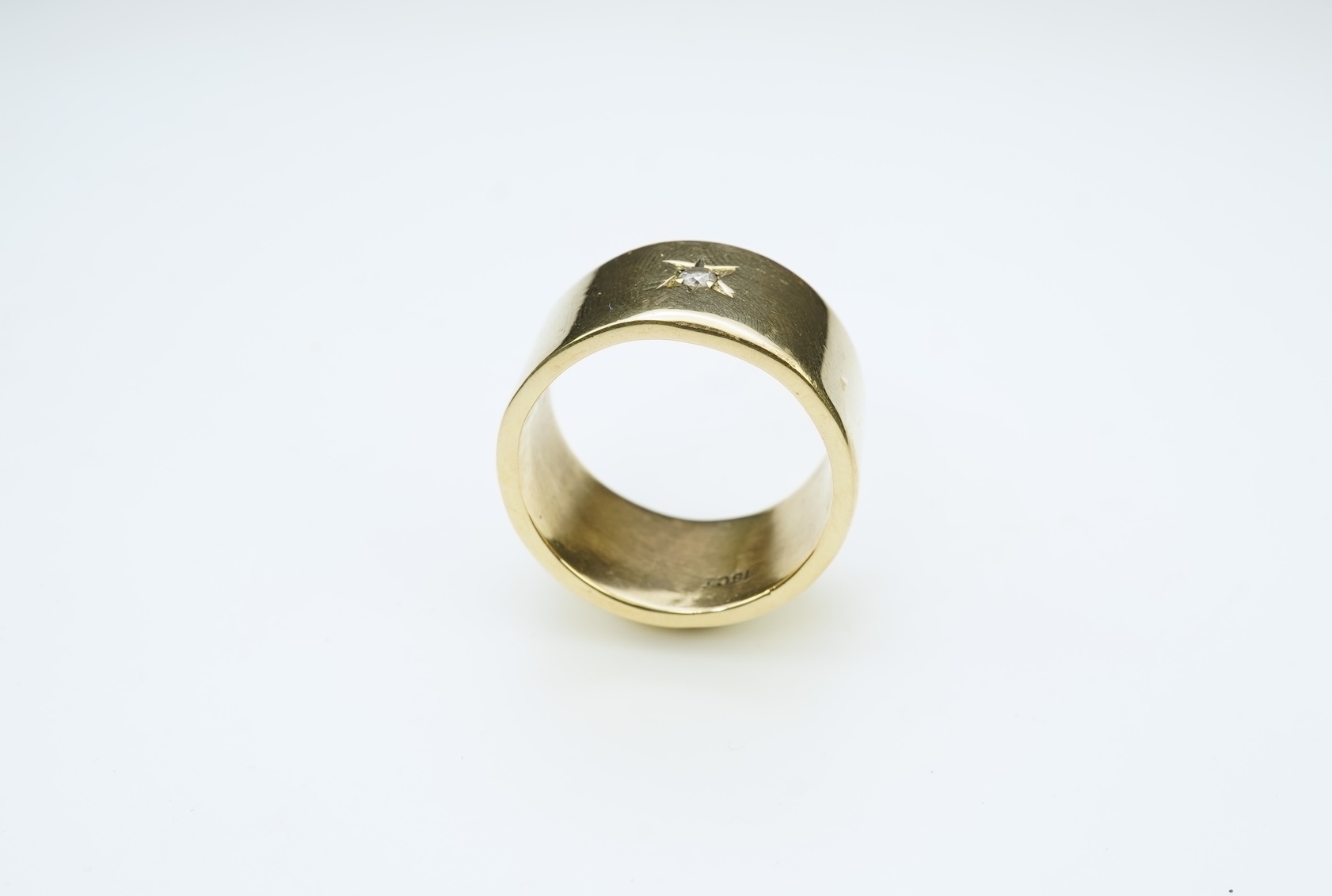 A gold and diamond ring